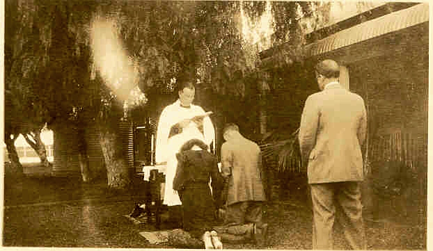 Above : Kneeling before the Minister and Don Beaton standing behind. Right : The happy bride and groom.