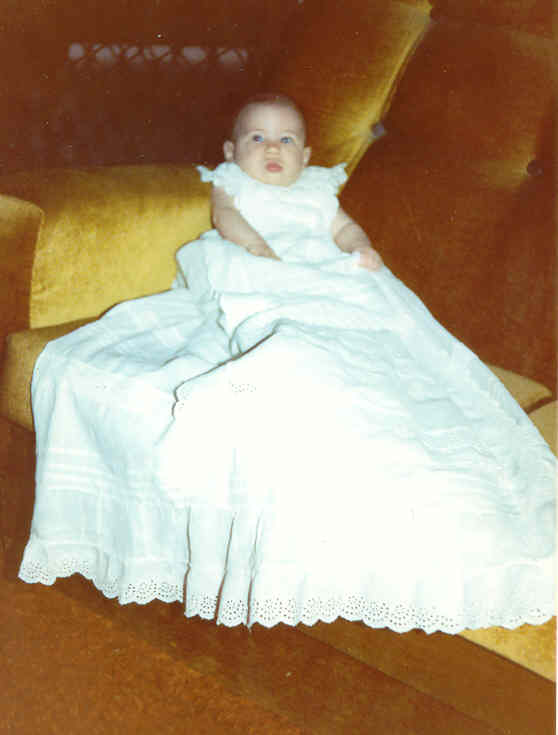 ` Helen’s great-grandaughter Mia in the christening gown made for Helen by her Aunts Ann and Nell in 1907.