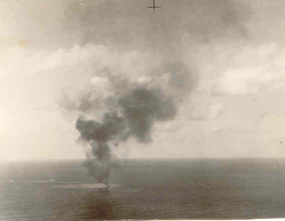 Aerial Photo of burning ship. Believed to be the bombing for which Don received the DFC.