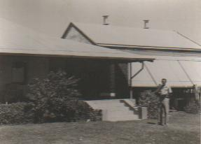 Duncan outside the front entrance to the house.