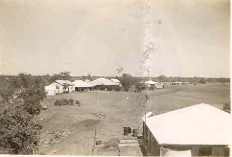 Roof in foreground is the mens quarters. 1st and 2nd houses top left are store houses 3rd with large roof is the main homestead house.