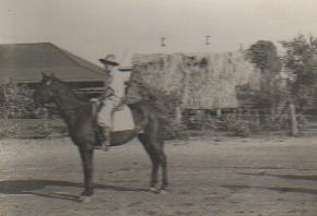 Duncan with the house and bough shed in background