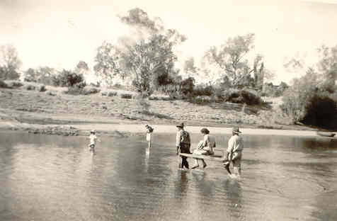 Betty Naylor being carried across