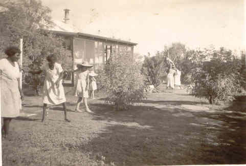 Battling a plague of grasshoppers on the front lawn.