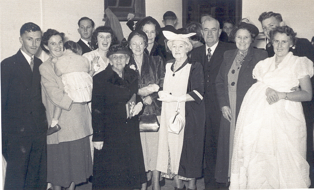 Wedding group at Ken and Gwen Sinclair’s wedding. L to r: Vaughn & Denise Butterley, Arlene Sinclair, Ann Beaton, ……….., (behind)Evelyn Sinclair, Nell Brain, Clarrie Sinclair, Rose Sinclair, Ken and his wife Gwen.